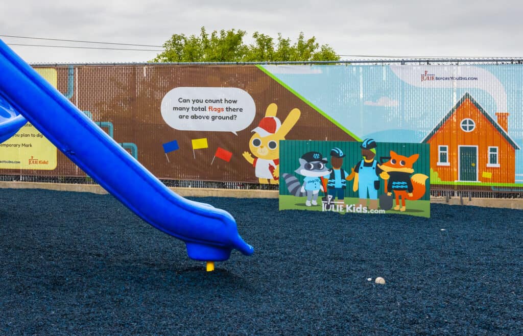 playground slide with julie fence wrapping in the background