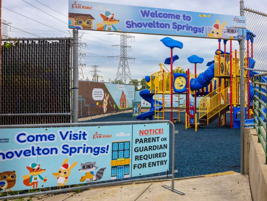 playground with a sign that reads "welcome to shovelton springs"